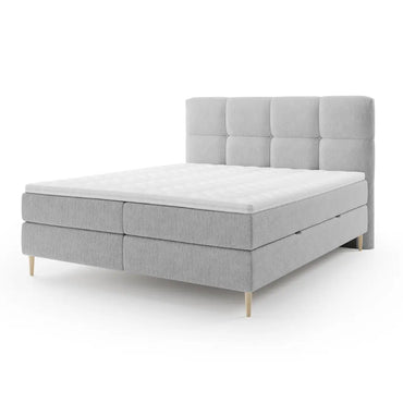 Lit BOXSPRING LEO - Avec tête de lit, coffre intégré, matelas ressorts ensachés et surmatelas inclus